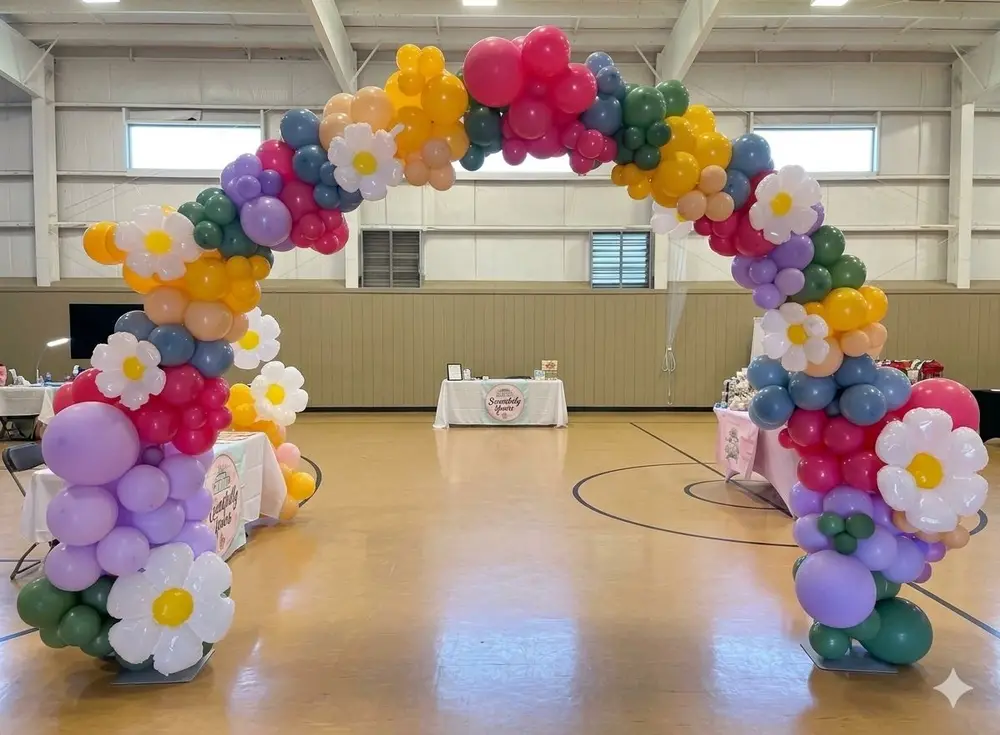 Colorful organic balloon arch with daisies