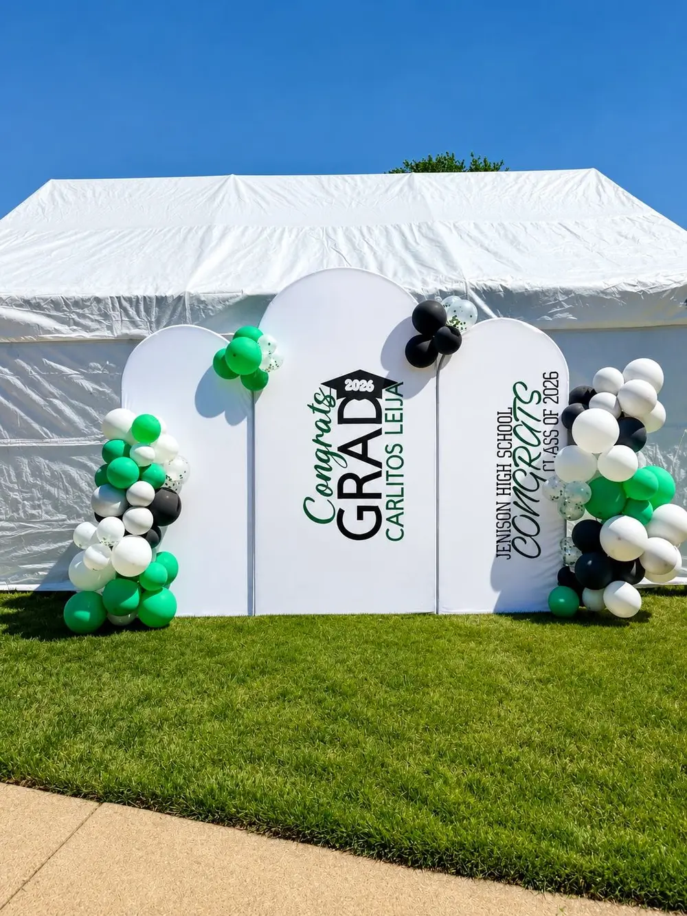 Graduation arch backdrop with green balloons