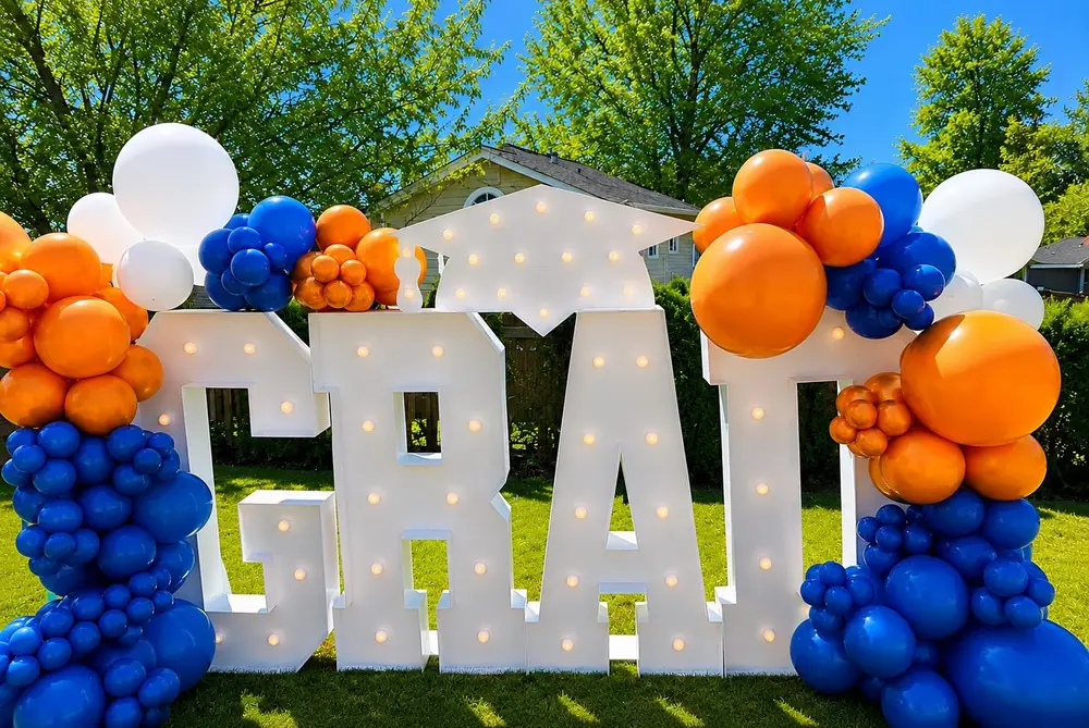 Graduation marquee letters with balloon garland