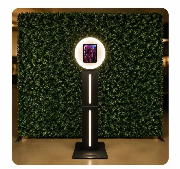 Photo booth in front of an 8ft by 8ft 3D greenery wall