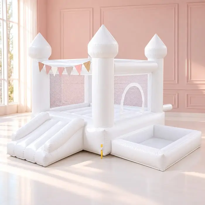 White bounce house castle with slide and empty ball pit